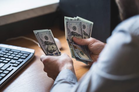 businessman-is-counting-dollars-banknotes-PCFS7CHJPG.jpg businessman-is-counting-dollars-banknotes-PCFS7CHJPG.jpg